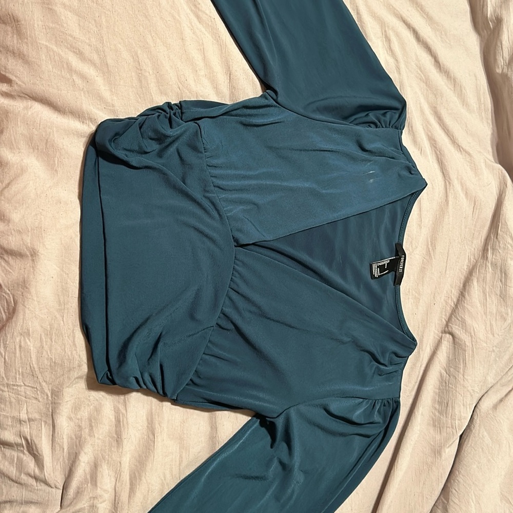Small deodorant stain near collar.
